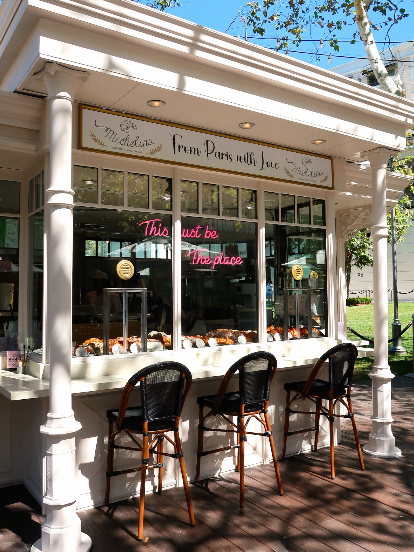 Storefront with bistro chairs — From Paris with Love.